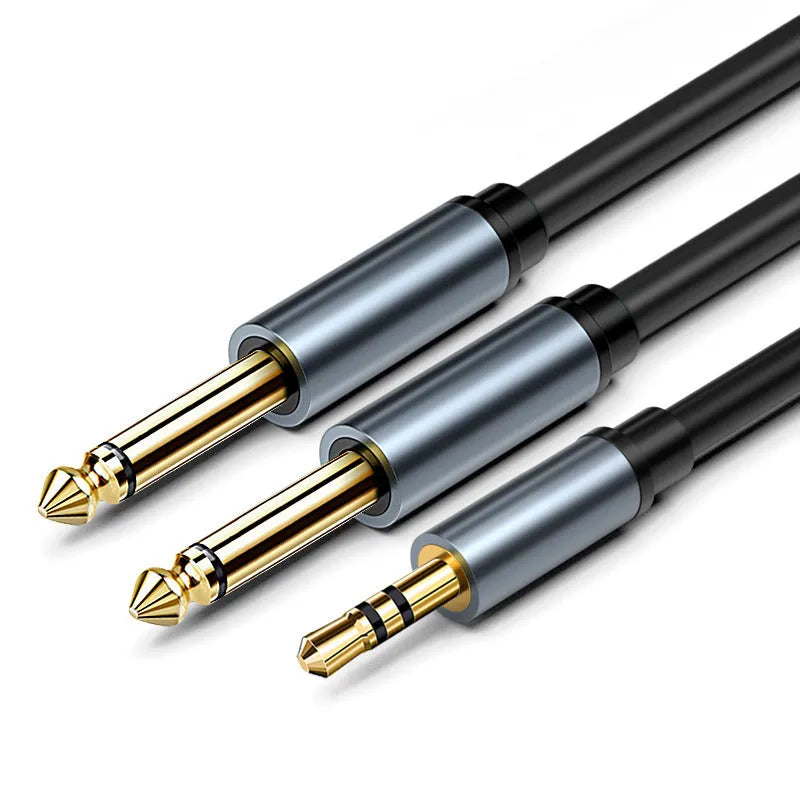 3.5mm to 6.35mm male-to-male audio cable with gold-plated connectors on a black coiled cable.