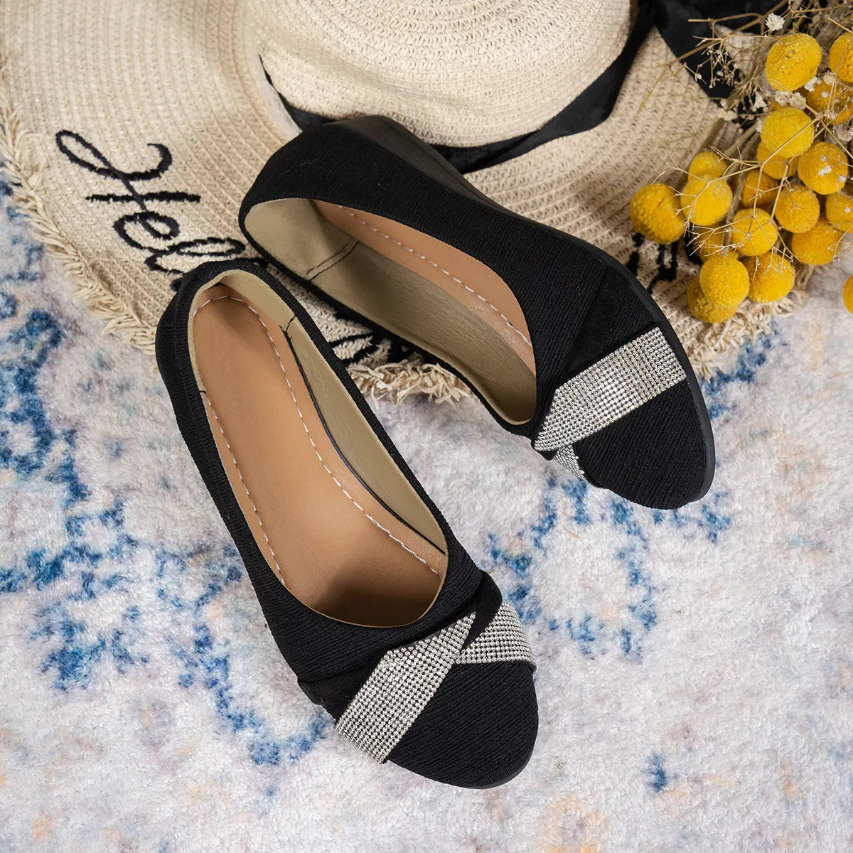 Black women's low-cut slip-on casual shoes with rhinestone decoration and a chunky short heel.