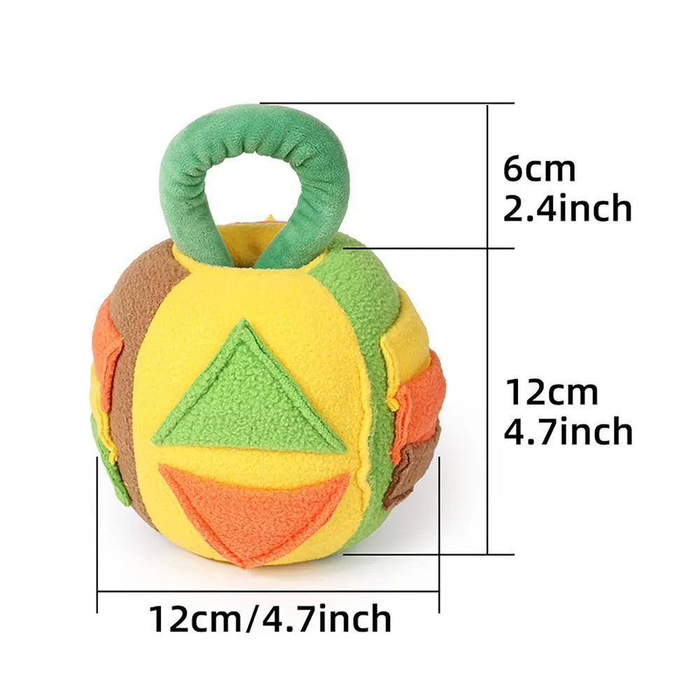 Green polyester squeaky plush ball dog toy with treat pockets on grass