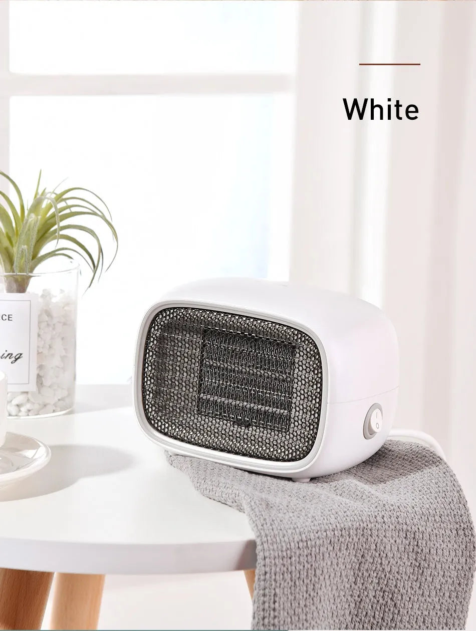Green mini ceramic heater with compact design showing dimensions and ventilation grille