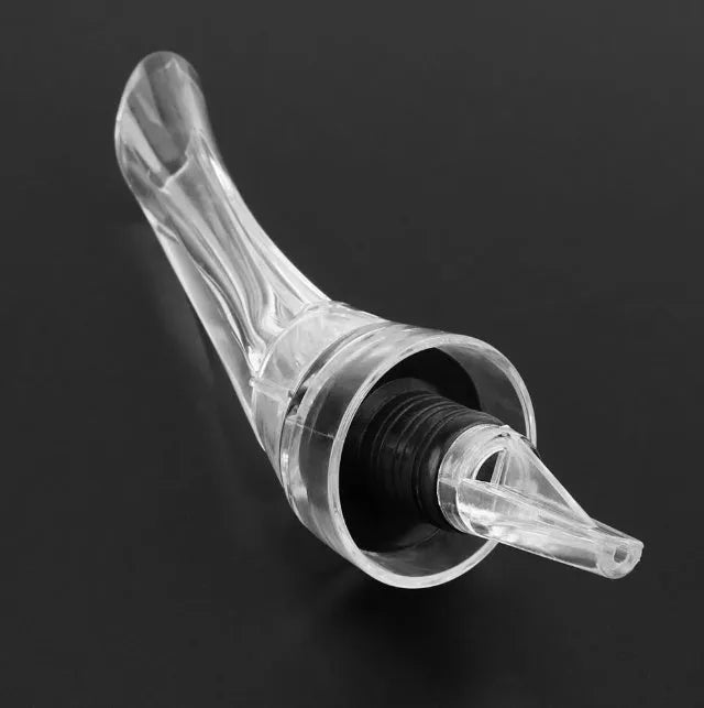 Compact transparent wine aerator with stainless steel filter measuring 16 by 4.2 centimetres