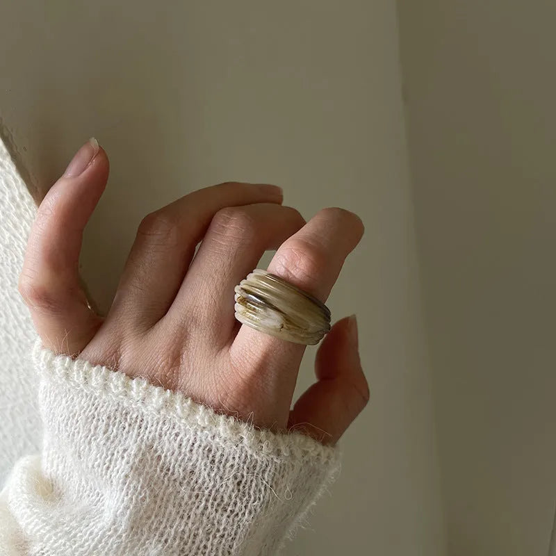 Chinese style irregular geometric wide resin ring in brown or white latte colour.