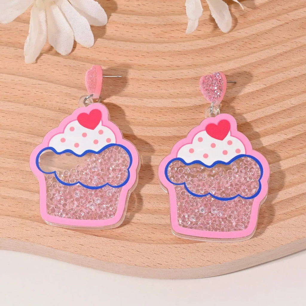 Colourful acrylic novelty earrings shaped like fruits and desserts including cherry, strawberry, and ice cream.