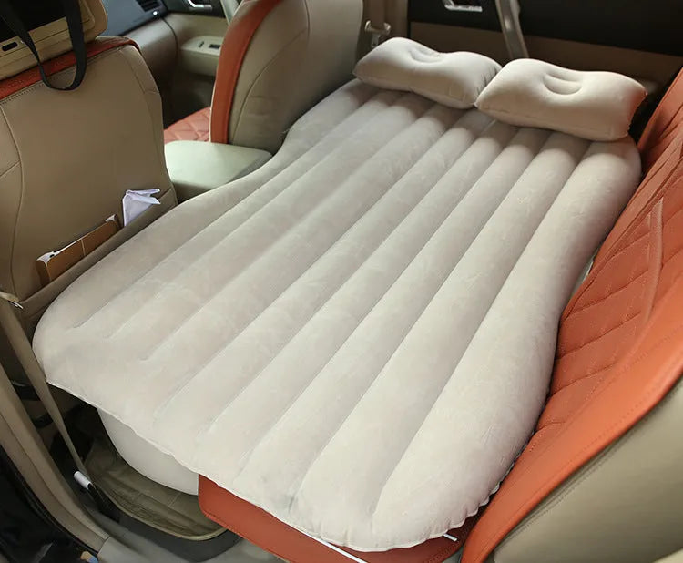 Thick flocking inflatable car air bed set with pump and pillows for five-seater vehicles.