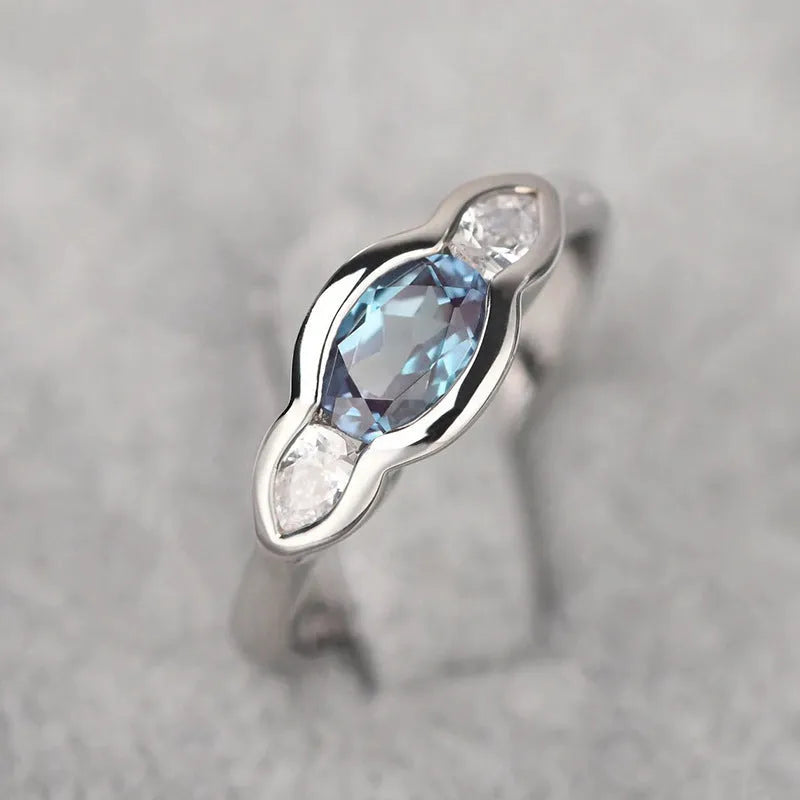 Geometric ellipse women's ring with inlaid zircon stones in Q941 white gold plating