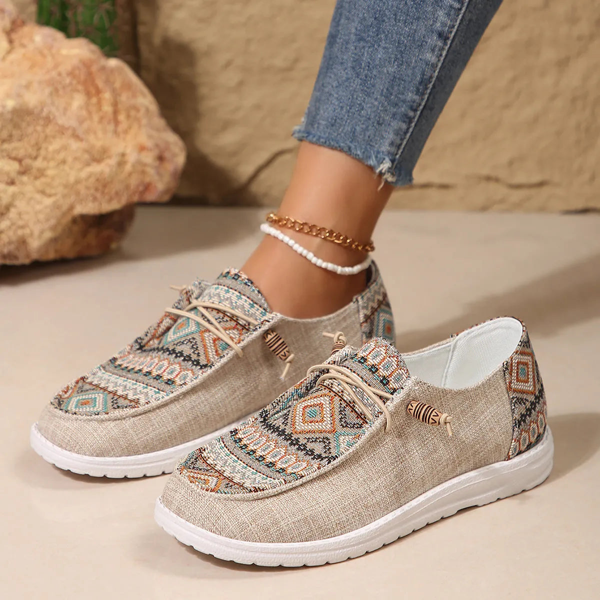 Women's flat round toe shoes in black, dark grey, and khaki with a low-top design and rubber sole.