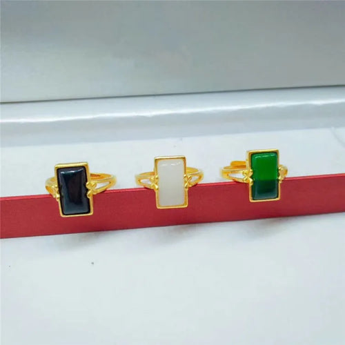 Adjustable brass ring with gold plating and coloured gemstone in national style design