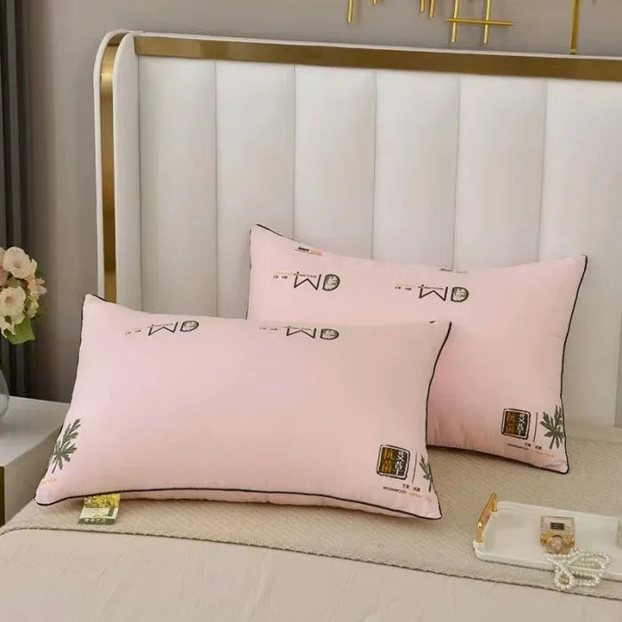 A standard 48x74cm polyester fibre filled pillow in a solid colour, shown on a bed.