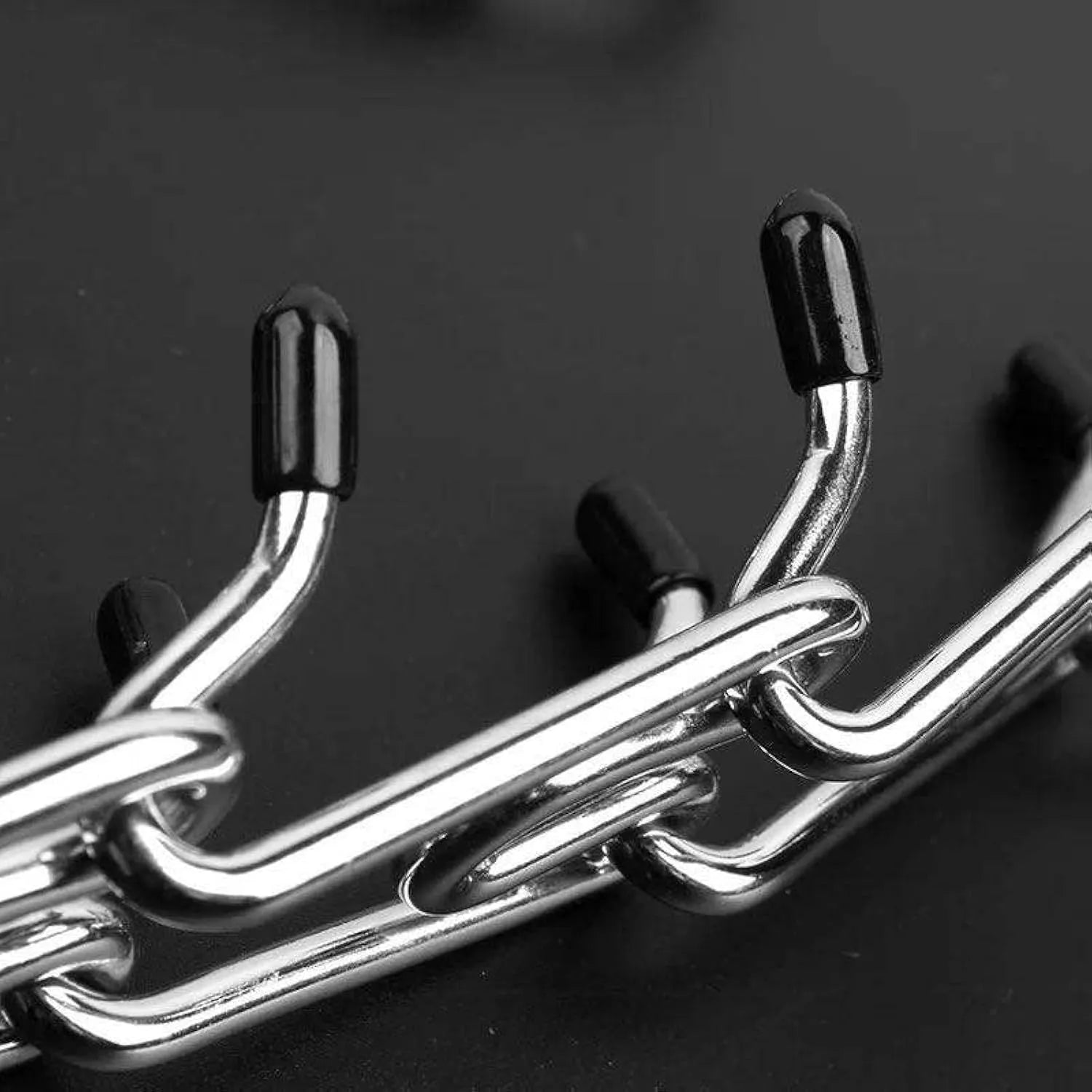 Stainless steel dog training collar with adjustable links and comfort rubber tips in four sizes