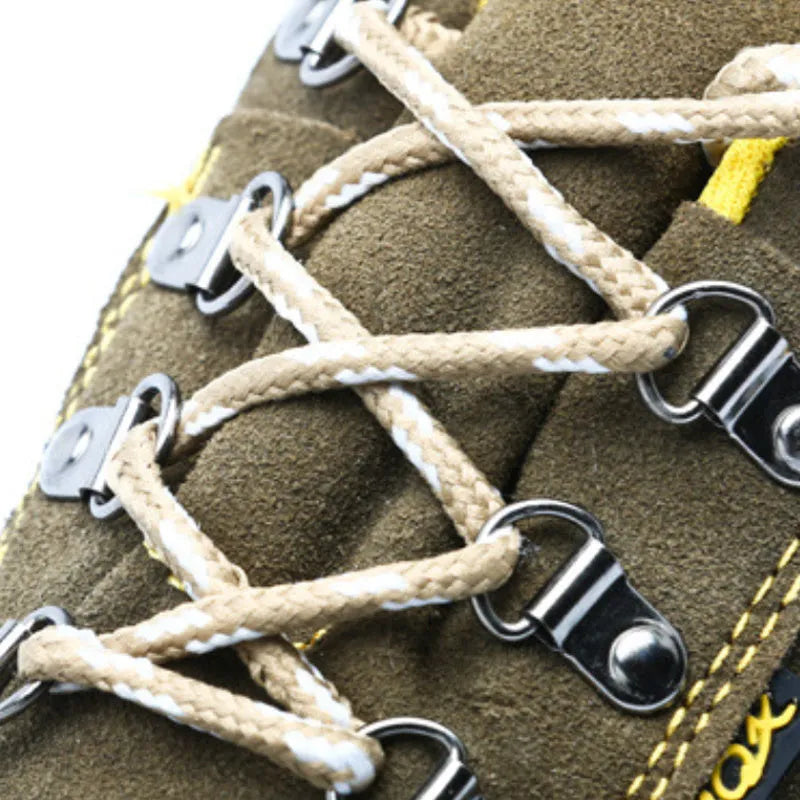 Bronze coloured low-cut steel toe safety boots with a cowhide suede upper and solid rubber sole.