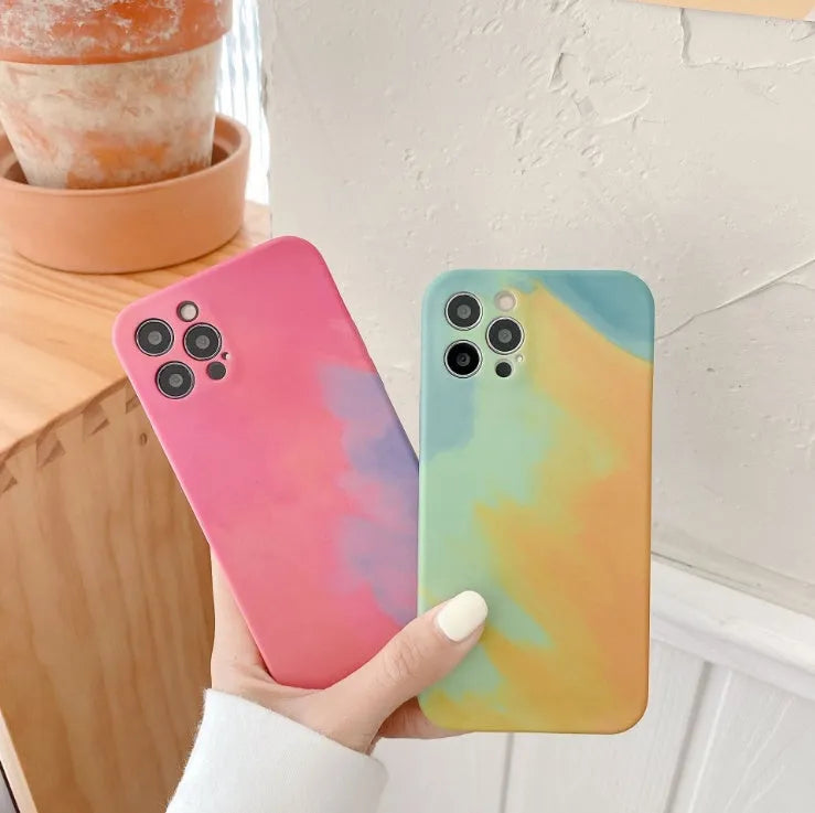 Soft silicone iPhone case with abstract blue gradient geometric design on a phone.