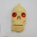 Skeleton skull shaped USB flash drive on a small metal chain with PVC shell.