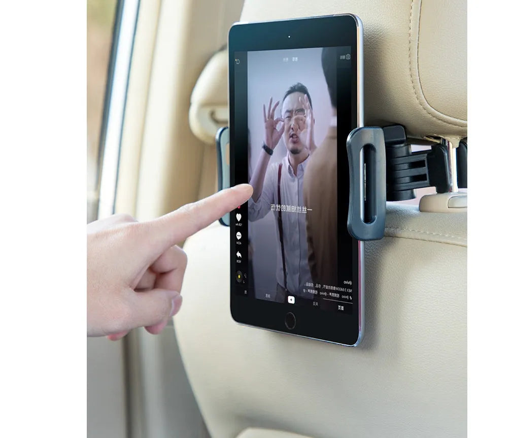 Black plastic car phone holder with universal tablet compatibility mounted on vehicle rear seat