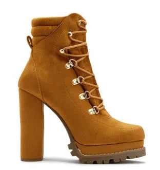 Women's suede ankle boots with thick heel in Roman style, showing decorative rivets and available in four colours