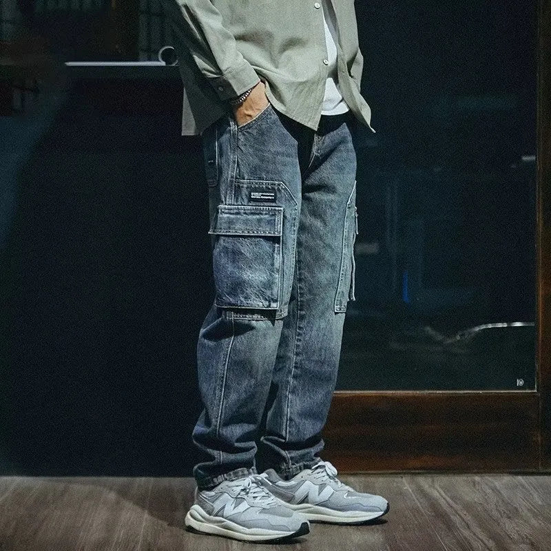 Men's blue loose straight-leg denim trousers with zip fly on mannequin