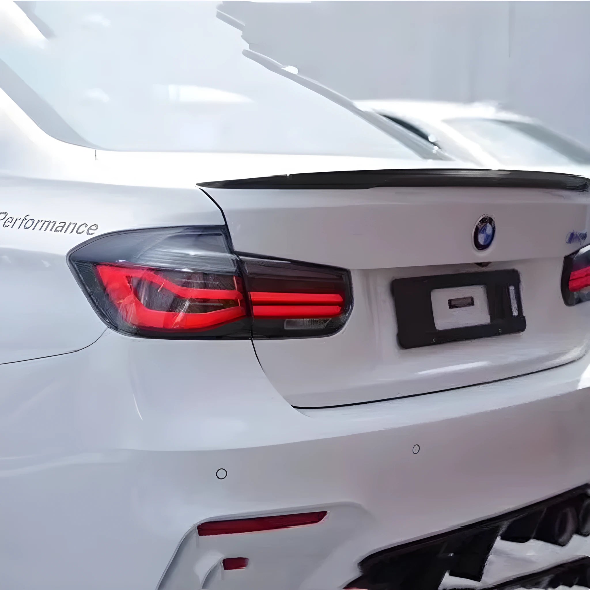 BMW 3 Series tail light assembly with LED streamer pattern in red or smoked black for 2012-2015 models