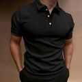 Man wearing a grey loose fit cotton blend short sleeve t-shirt for casual leisure wear.