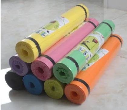 EVA fitness yoga mat in red showing textured anti-skid surface with storage bag