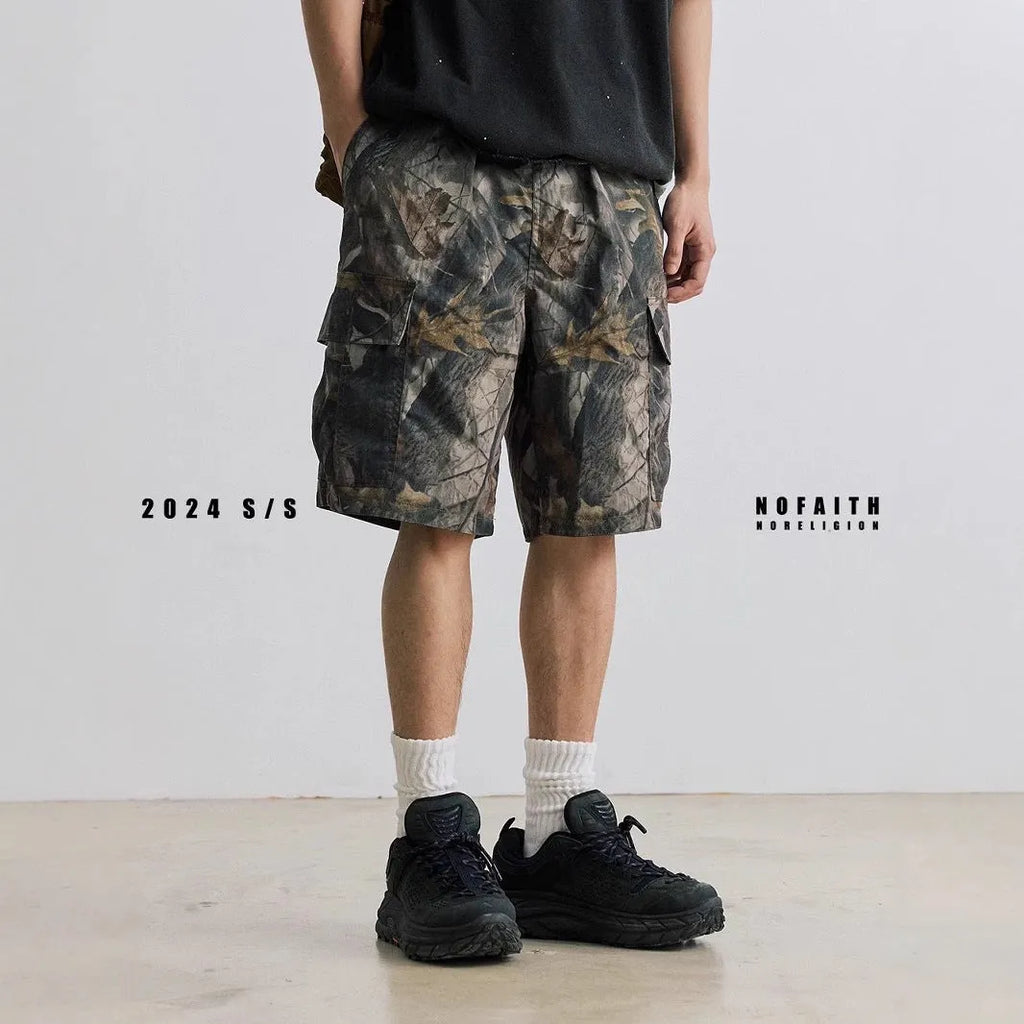 Loose casual straight-leg denim shorts in army green with a zip fly and elasticated waistband.