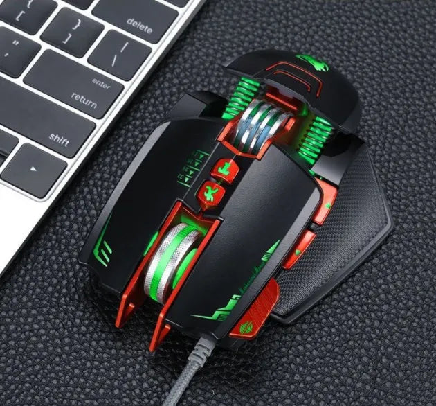 Thunder Wolf V9 black wired gaming mouse with six buttons and USB cable on gaming desk