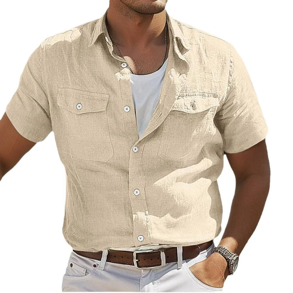 Man wearing a loose-fitting grey cotton cardigan-style shirt with long sleeves.