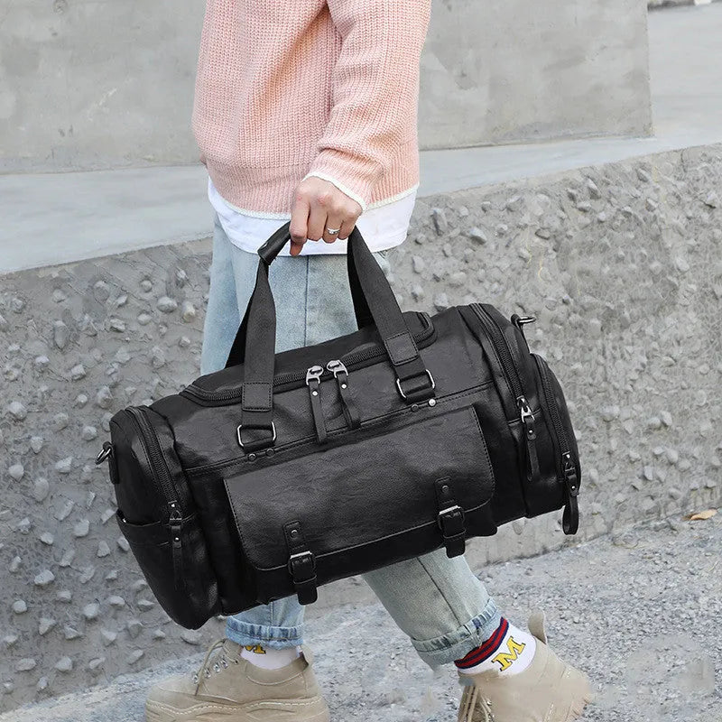 Large black travel bag with shoe compartment, made from waterproof PU material.