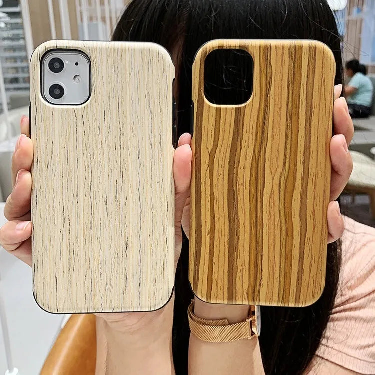 A slim wooden back cover case for an iPhone, showing the natural grain of rosewood or bamboo.