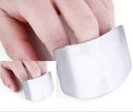 Stainless steel finger guard for protecting fingers when cutting vegetables on a chopping board.