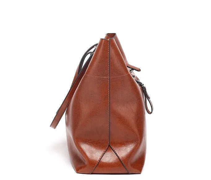 Women's wax cowhide leather handbag with horizontal silhouette and cross-body strap