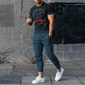 Man wearing a short-sleeved printed round neck pullover and matching trousers from a lightweight athletic suit set.