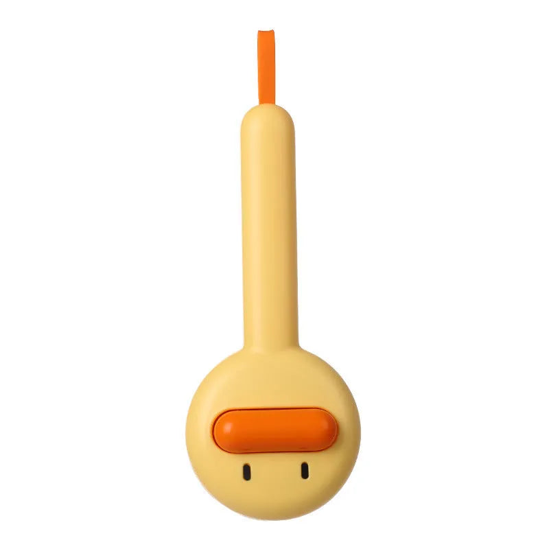 Small yellow duck-shaped pet comb with open sections and floating needles for cat and dog hair removal