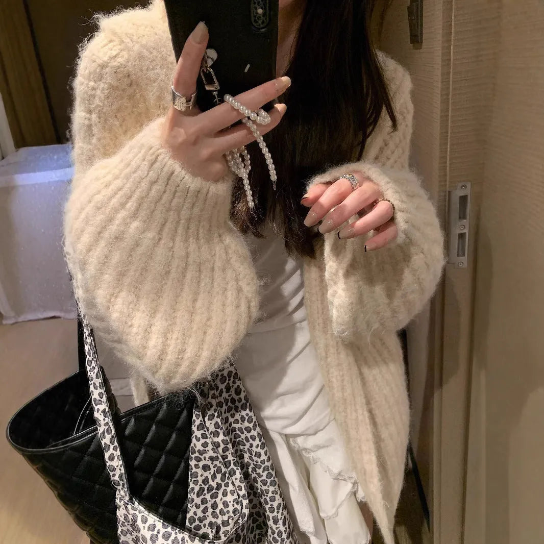 Women's loose fit hooded cardigan in thick acrylic fabric, shown in brown, dark grey, and milky white colour options