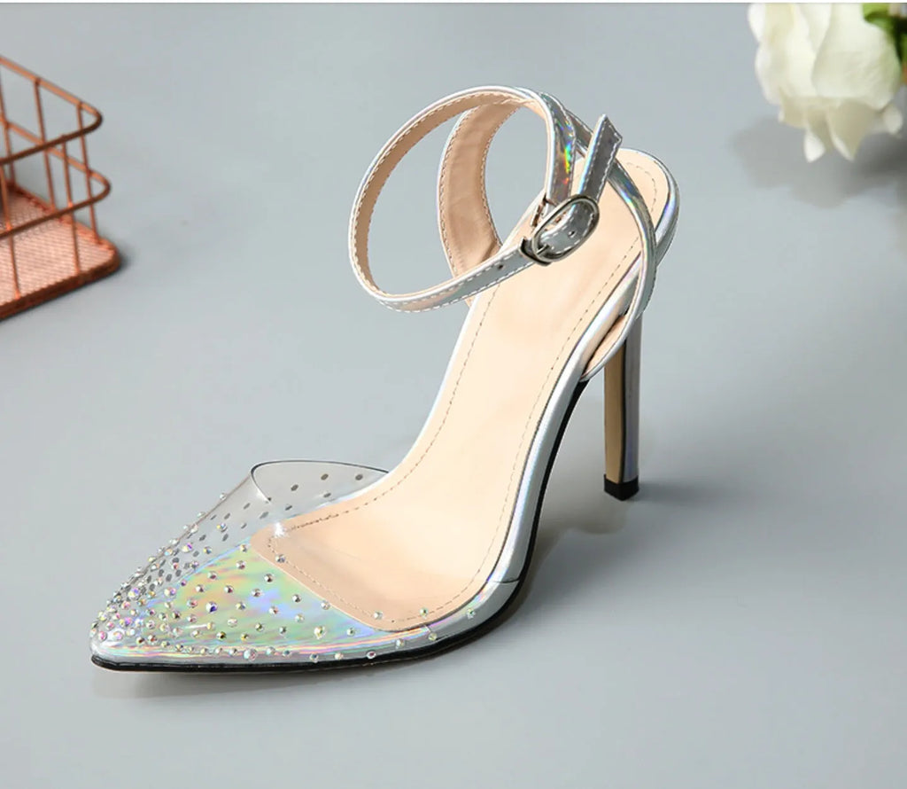Women's clear PVC pointed toe sandals with a stiletto heel on a white background.