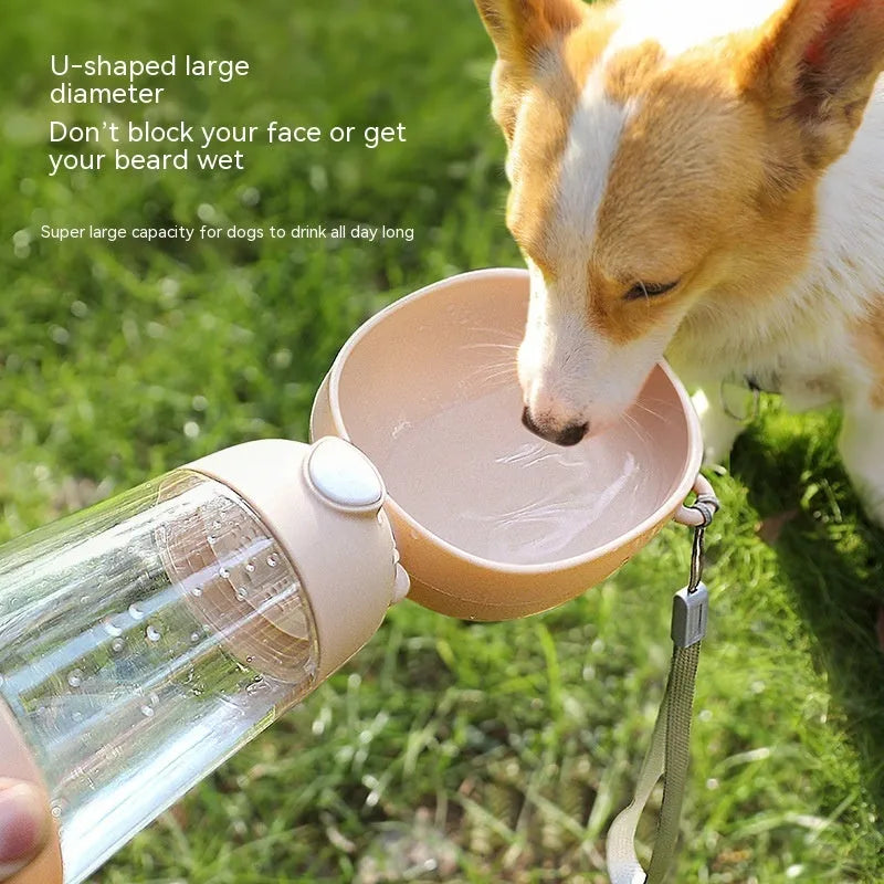 Portable dog water bottle and feeder bowl in brown, pink, or yellow colours for outdoor use