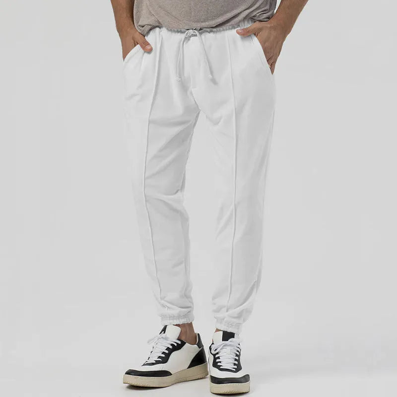 Men's casual track sweatpants in loose tapered straight-leg design showing army green colour option