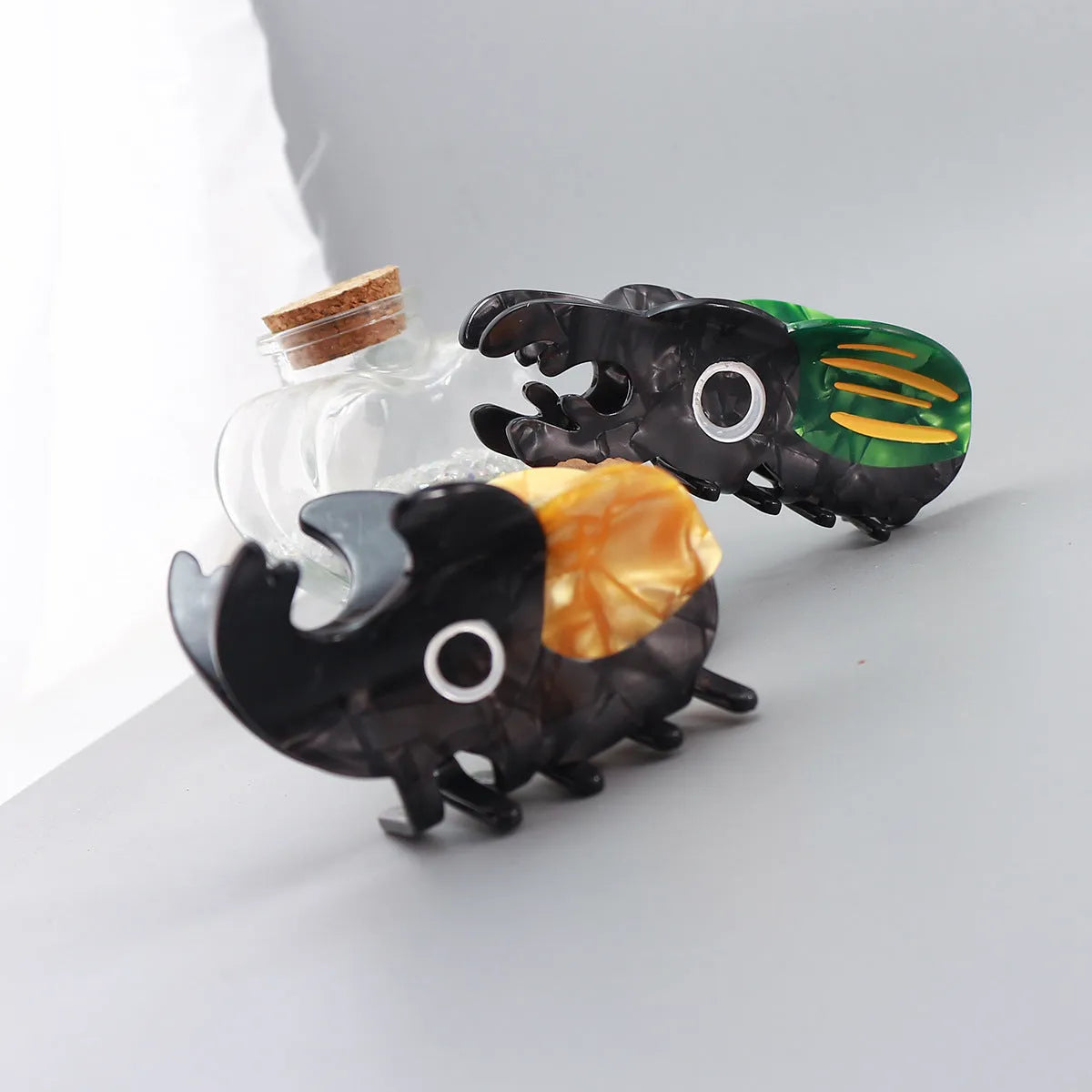 Cartoon-style beetle grip insect biology collectable on cellulose acetate sheet