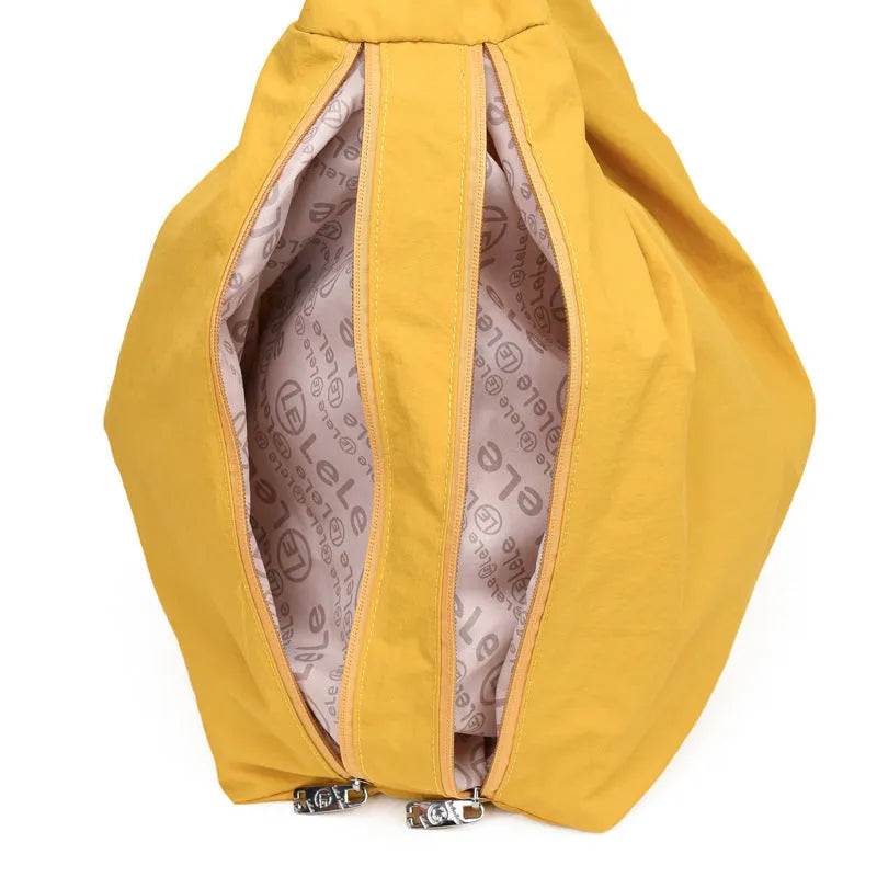 Soft nylon women's underarm bag in a heart shape, shown in black, blue, khaki, and yellow colour options.