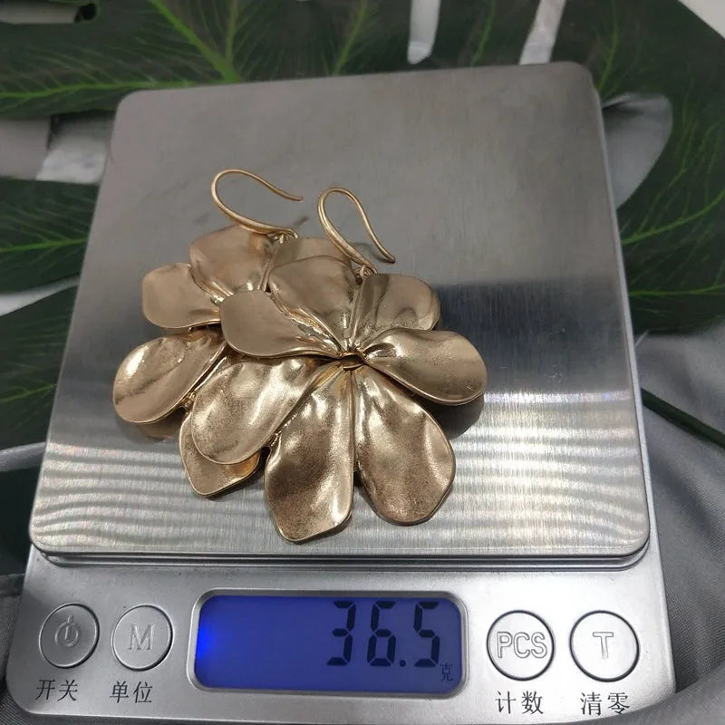 Vintage-style distressed leaf earrings for women in alloy, original silver colour finish on a plain background