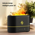 White USB humidifier with seven-colour flame effect on wooden desk showing mist output