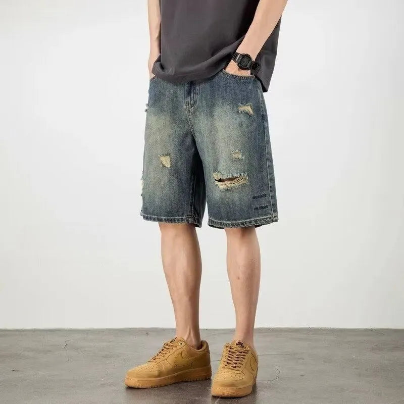 Blue men's denim shorts with a retro loose hole design and straight-leg cut.