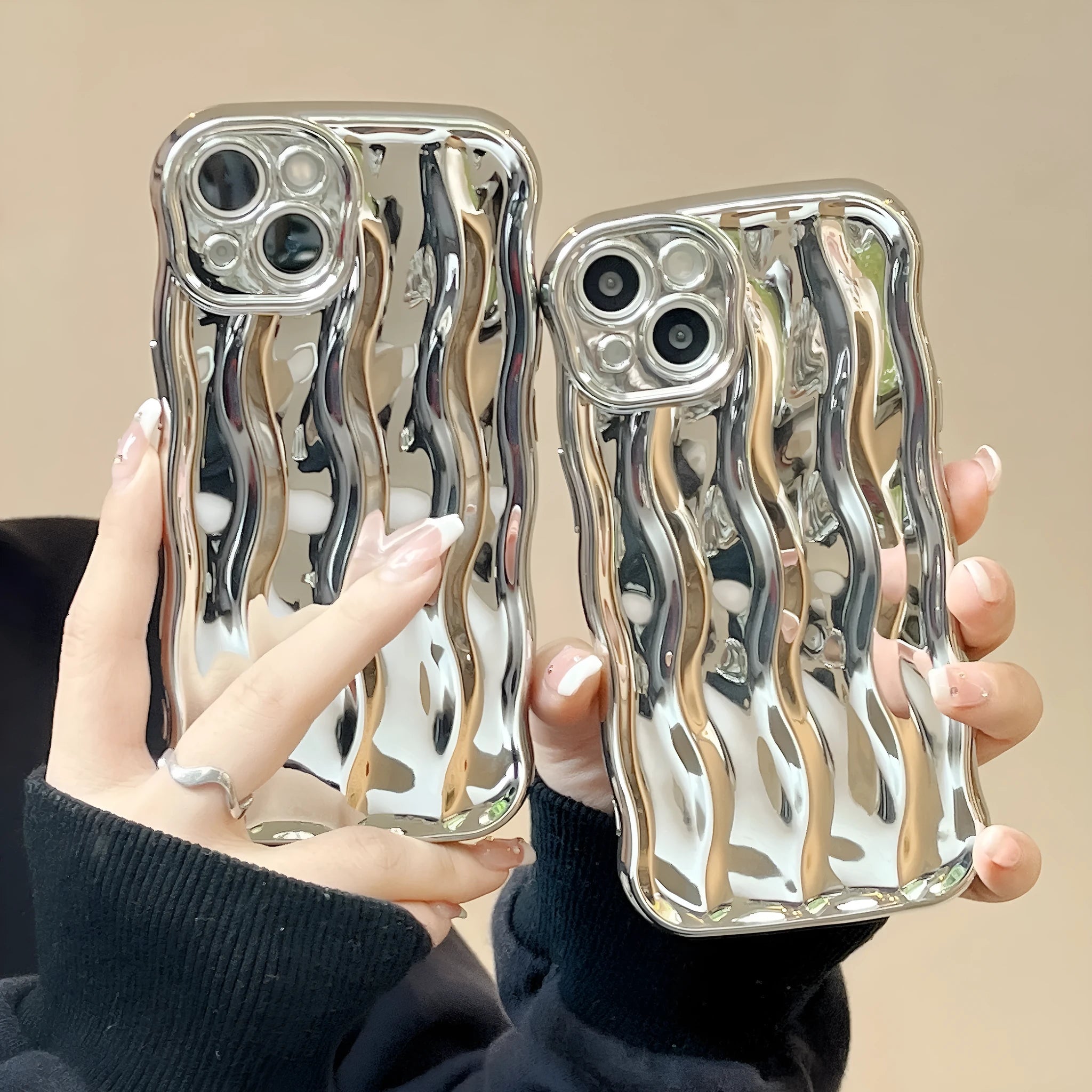 Electroplated three-dimensional wave stripe protective case for iPhone 17 on a table.