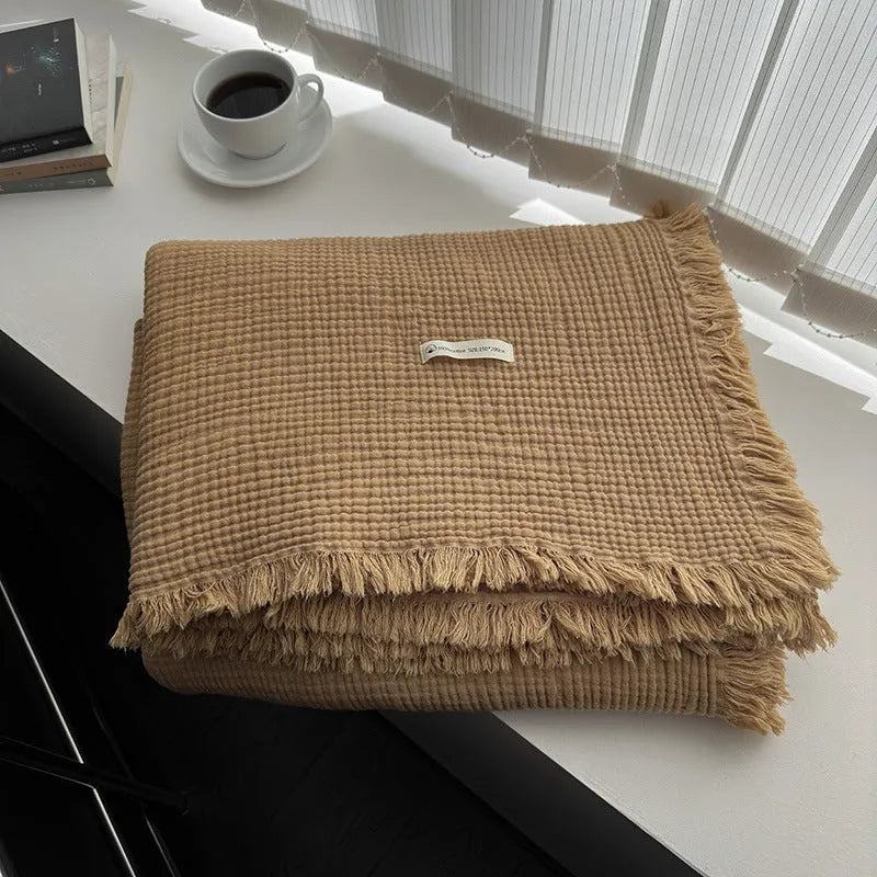 Four-layer gauze cotton blanket with tassel detailing in navy blue colour option