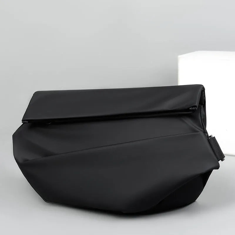 Grey PU crossbody bag showing front zipper compartment and adjustable shoulder strap
