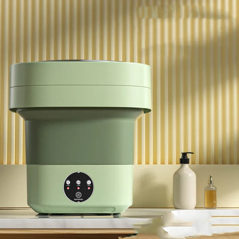 Mini foldable washing machine in green with blue light sterilisation and drain basket