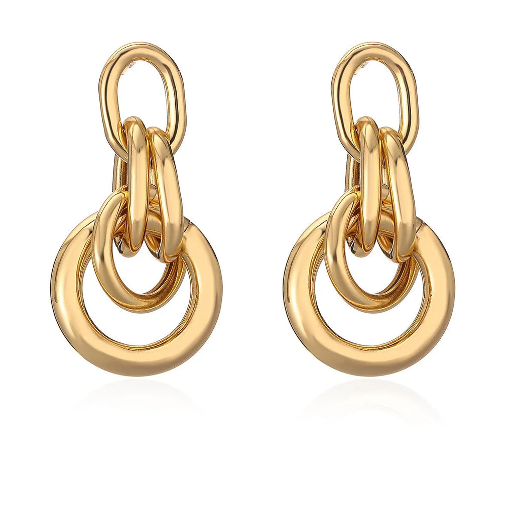 Geometric copper earrings with gold colour finish in irregular shape