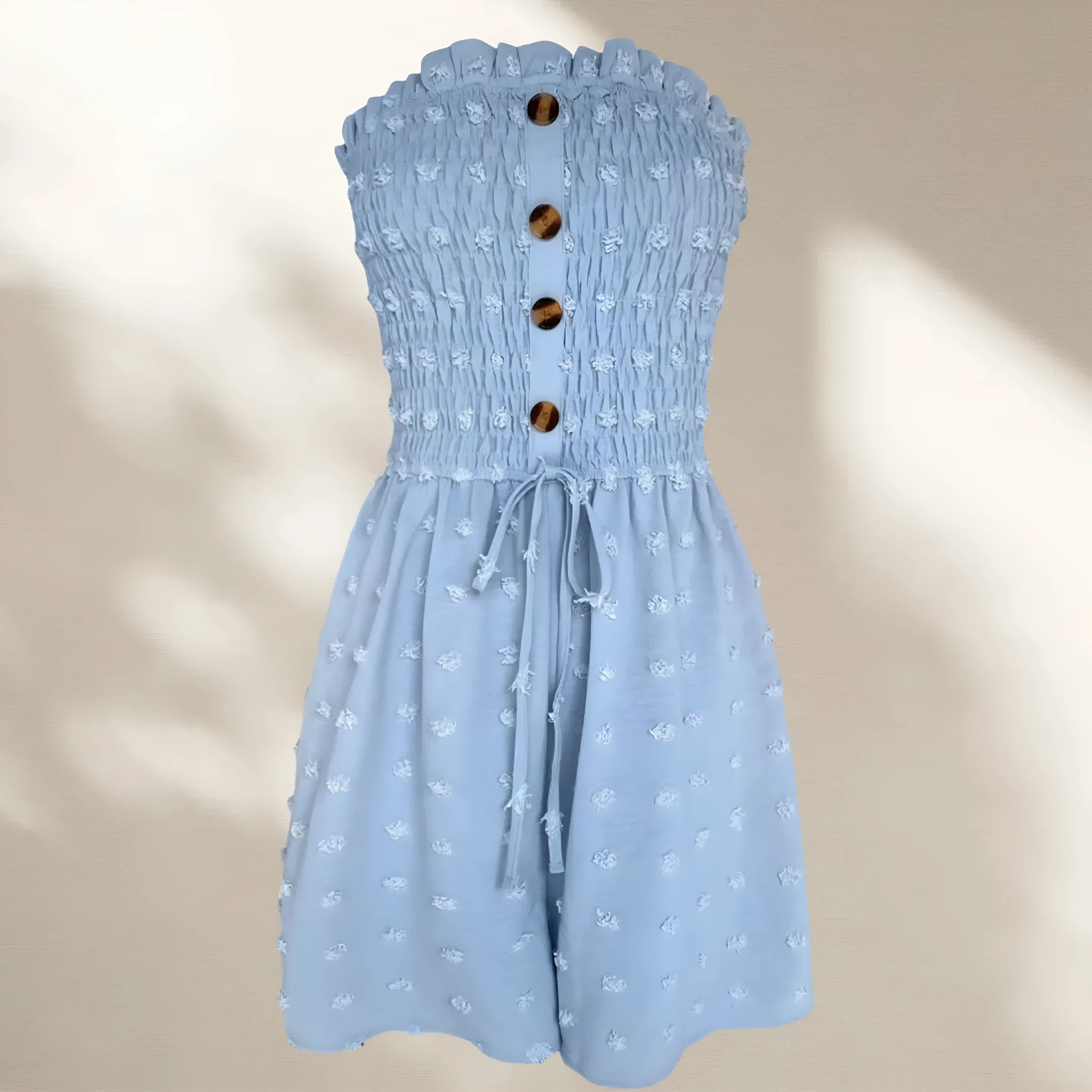 Blue women's off-shoulder sleeveless jumpsuit with button detail on mannequin
