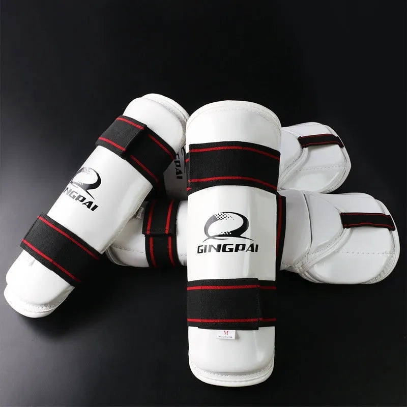 Taekwondo protective gear set showing arm guards, elbow arm guards, and leg protectors in various sizes
