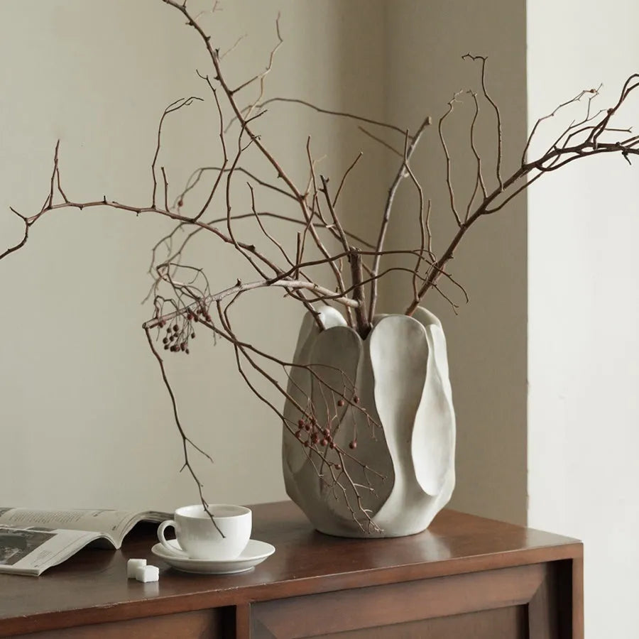 Irregular ceramic vase for flower arrangements in high style or low style profile