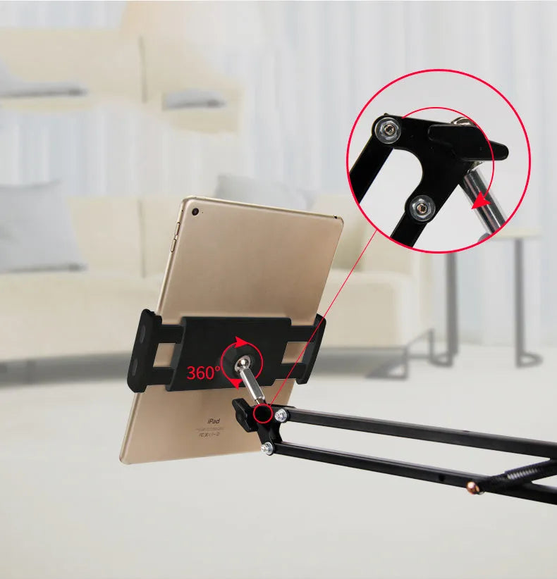 Black and white adjustable phone and tablet stand on a desk at 10cm height