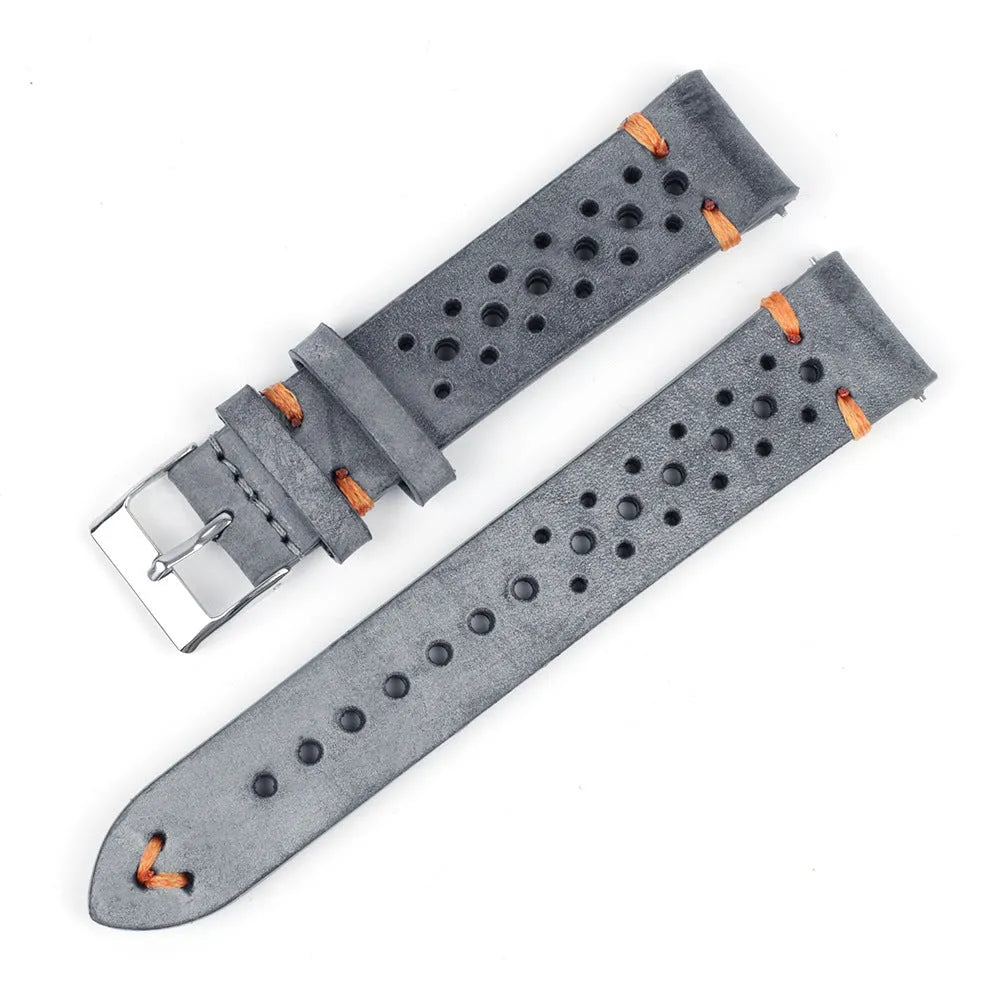 Handmade retro genuine leather watch band in brown with white stitching on a wooden surface